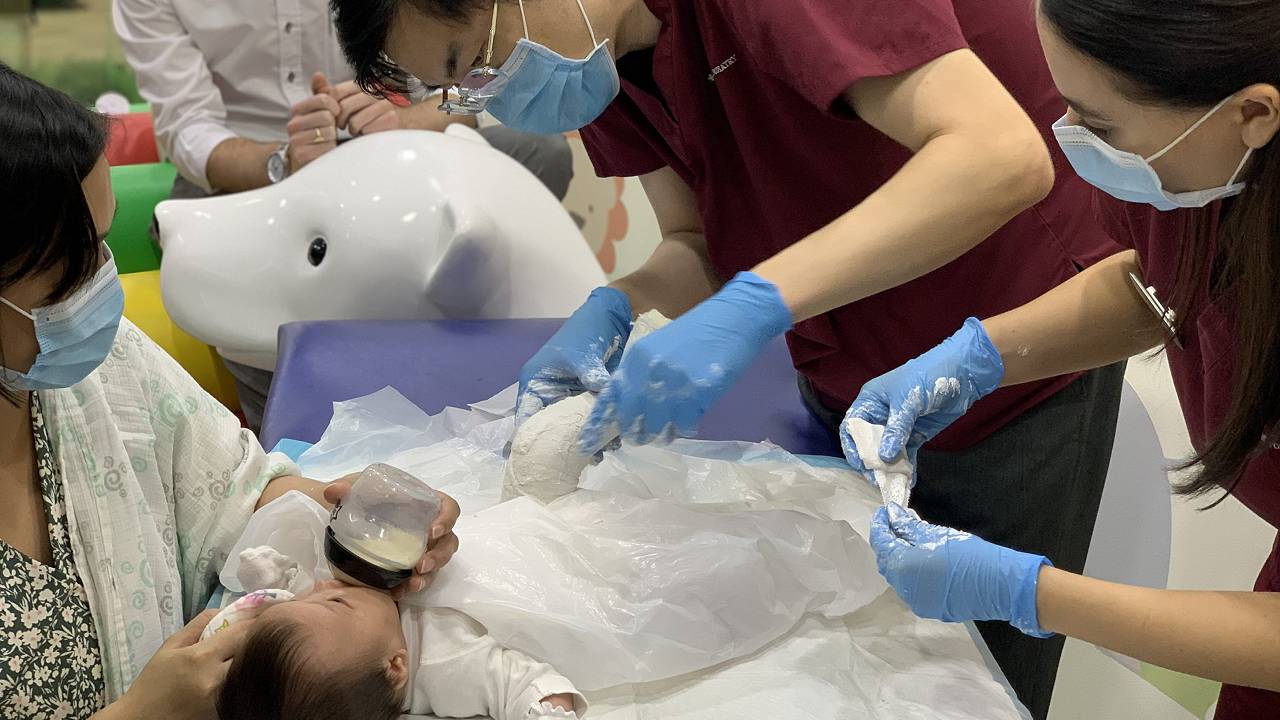 Podiatrists Dr. Michael Lai and Chantelle Crossland applying a cast